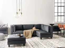 Outlet Beliani Divano angolare modulare 4 posti UNSTAD Pelle sintetica Nero con ottomana Nero Nero