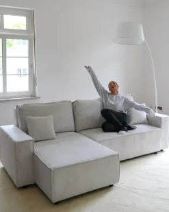 Beliani Divano letto angolare 3 posti ABACKA Velluto a coste Bianco sporco Bianco Nero