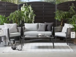 Beliani Set da giardino con tavolo 4 posti PREVEZA Rattan sintetico (PE) Grigio Grigio Nero