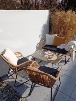Outlet Beliani Set da giardino con tavolo 4 posti MINORI Rattan sintetico (PE) Beige Beige Naturale Nero