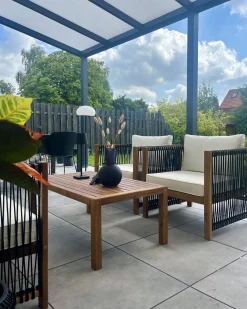 New Beliani Set da giardino con tavolo 4 posti ANTRIA Legno d'acacia Nero Marrone Nero