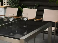 Clearance Beliani Set da pranzo da giardino 8 posti GROSSETO Piastra tripla Granito Lucido Nero/Beige Beige Argento Nero