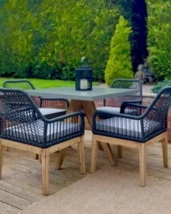 New Beliani Set da pranzo da giardino 4 posti OLBIA con cuscini Cemento Nero Grigio Marrone Nero