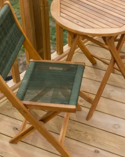 Beliani Set da pranzo da giardino 4 posti PROSSEDI Legno d'acacia Verde Marrone Verde