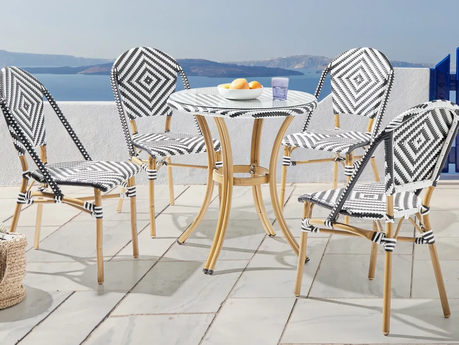 Outlet Beliani Set da pranzo da giardino 4 posti RIFREDDO Rattan sintetico (PE) Nero/Bianco Bianco Beige Naturale Nero