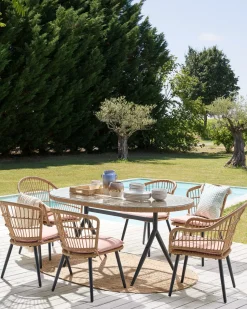 Beliani Set da pranzo da giardino 6 posti ALIANO con cuscini Rattan sintetico (PE) Rosa pastello Beige Naturale Nero Rosa