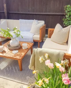 Beliani Set salotto da giardino con tavolo e pouf 5 posti BARATTI Legno d'acacia Marrone Beige Marrone