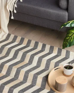Outlet Beliani Tappeto BAGGOZE Grigio scuro Pelle naturale Beige Grigio