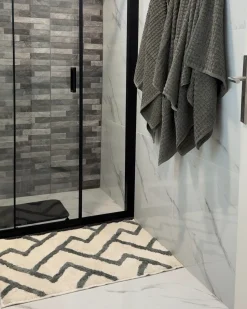 Beliani Tappeto da bagno GARHI Beige 60 x 90 cm Cotone Beige Grigio