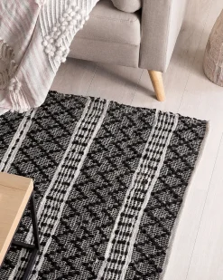 Beliani Tappeto FEHIMLI Nero Pelle naturale Beige Nero