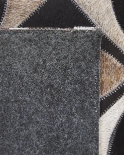 Outlet Beliani Tappeto ISHAN Multicolore 140 x 200 cm Pelle naturale Bianco Marrone Nero Multicolore