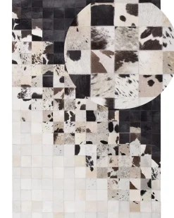 Sale Beliani Tappeto KEMAH Nero 140 x 200 cm Pelle naturale Bianco Nero