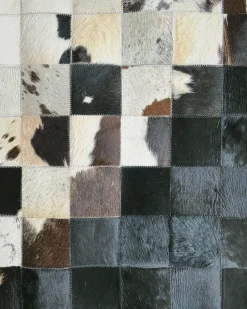 Sale Beliani Tappeto KEMAH Nero 140 x 200 cm Pelle naturale Bianco Nero