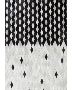 Outlet Beliani Tappeto MALDAN Nero Pelle naturale Beige Bianco Nero