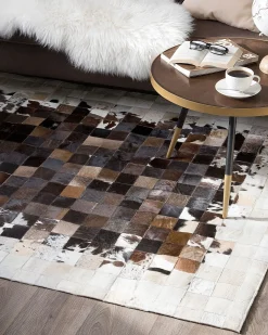 Clearance Beliani Tappeto OKCULU Marrone 140 x 200 cm Pelle naturale Beige Marrone Nero