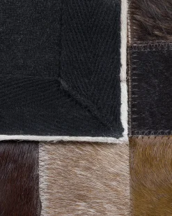 Clearance Beliani Tappeto OKCULU Marrone 140 x 200 cm Pelle naturale Beige Marrone Nero