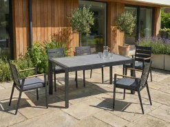 Sale Beliani Tavolo da pranzo allungabile da giardino BINASCO 160/220 cm 90 cm Effetto pietra Grigio Grigio Nero